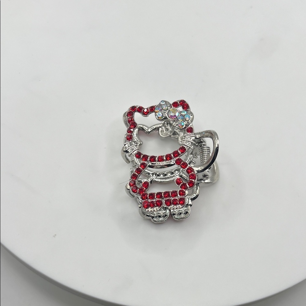 928. Hello Kitty Silver and Red Hair Clip